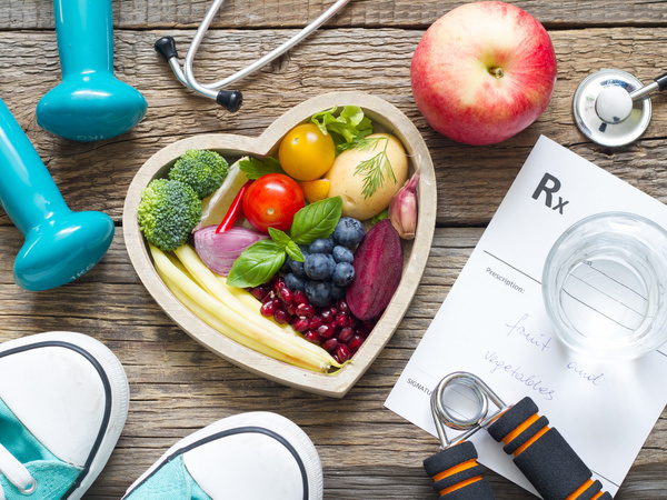 Fitness equipment and heart shaped bowl of fruit